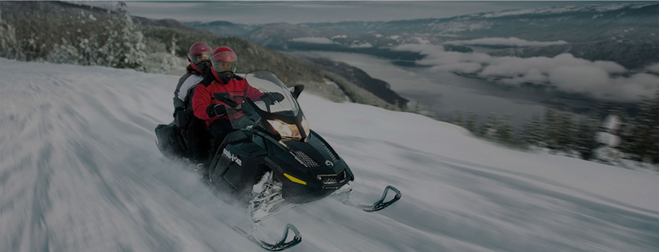 mountain snowmobiling in the winter